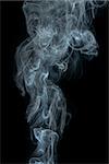 Smoke on black background. Swirls and art