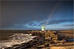 rainbow over lighthouse and North sea, Ijmuiden, Netherlands