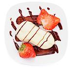 Arrangement of White Chocolate Eclair with Chocolate Sauce and Sliced Strawberry on White Plate closeup on white background. Top View