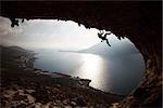 Silhouette of a rock climber at sunset. Kalymnos Island, Greece