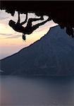 Silhouette of a rock climber at sunset. Kalymnos Island, Greece.