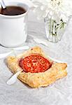 Breakfast with tomato tarts and cup of tea