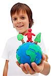 Life in harmony with nature concept - boy holding earth globe with trees and man made of colorful clay