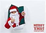 Santa popping out of torn edges hole with thumbs up sign - copy space