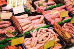 Meat and sausages in a butcher shop. Stand