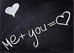 romantic text handwritten on blackboard with chalk, valentines day
