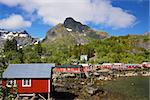 Typical red rorbu fishing huts with sod roof on Lofoten islands in Norway