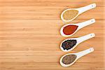 Colorful herbs and spices selection. Aromatic ingredients on cutting board with copyspace