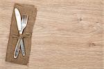 Silverware or flatware set of fork and knife on wooden table