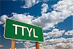 TTYL, Texting Abbreviation for Talk To You Later, Green Road Sign with Dramatic Sky and Clouds.