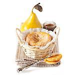 French cheese Langres in a basket with pear, crackers and confiture.