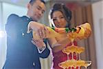 Asian Chinese wedding dinner reception, bride and groom champagne toasting, natural candid photo.