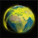 Planet Earth with glowing yellow connections between cities and continents representing global airline networks. Elements of this image furnished by NASA