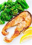 Salmon steak with broccoli on a plate