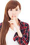 beautiful young woman with finger on lips