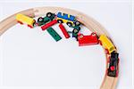 derail wooden toy train in top view. horizontal image