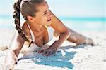 Young woman laying on beach