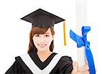 pretty Young graduate girl student holding and showing diploma