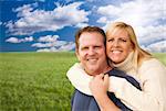 Portrait of A Happy Attractive Couple Hugging at the Park.