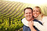 Happy Affectionate Couple Hugging at a Beautiful Wine Vineyard.