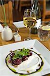 Beautifully plated beet salad with pistachios.