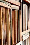 Books on the shelves in the library shown closeup