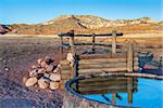 cattle watering hole in Red Mountain Open Space, semi desert landscape in northern Colorado near Wyoming border, late summer, reservoir fabricated from old giant tire