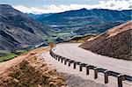 A scenic road passes through mountains and valleys north of Queenstown on New Zealand’s South Island.