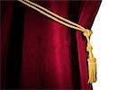 Red velvet curtain with tassel. Close up white isolated curtain