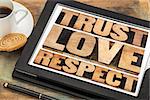 trust, love and respect word abstract in vintage letterpress wood type on a digital tablet
