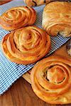 Fresh buns on wooden table