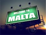 Welcome to Malta - Green Billboard on the Rising Sun Background.