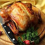Roasted whole chicken on a cutting board