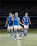 Soccer players cheering on field