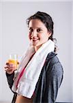 Portrait of Teenager with Glass of Orange Juice