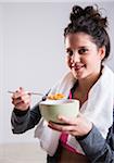 Portrait of Teenager Eating Bowl of Cereal