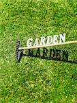 Garden Rake with the Text Garden on Grass