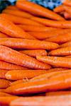 fresh orange carrot bundle on market in summer outdoor
