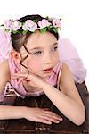 Brunette ballet girl against a white background wearing pink