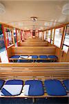 ST. WOLFGANG, AUSTRIA -  Steam train,  passenger benches inside railcar going to Schafberg Peak (1783m),  St. Wolfgang.