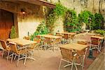 old-fashioned coffee terrace with tables and chairs,paris France