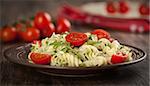 Fusilli pasta with tomato and arugula