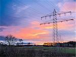 Electricity pylon at sunset with evening sky