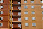 High rise construction. Brick houses under construction.