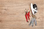 Silverware or flatware set of fork, spoon and knife on wooden table