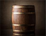 Old wooden barrel on a brown background