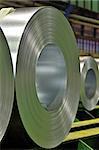 packed rolls of steel sheet in a warehouse