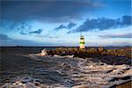 green lighthouse on North sea, Ijmuiden before sunset