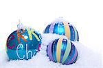 christmas decoration baubles in blue and turquoise isolated on white