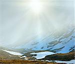 Evening misty-sunshine mountain view (near Timmelsjoch - high alpine road on Italian - Austria border)